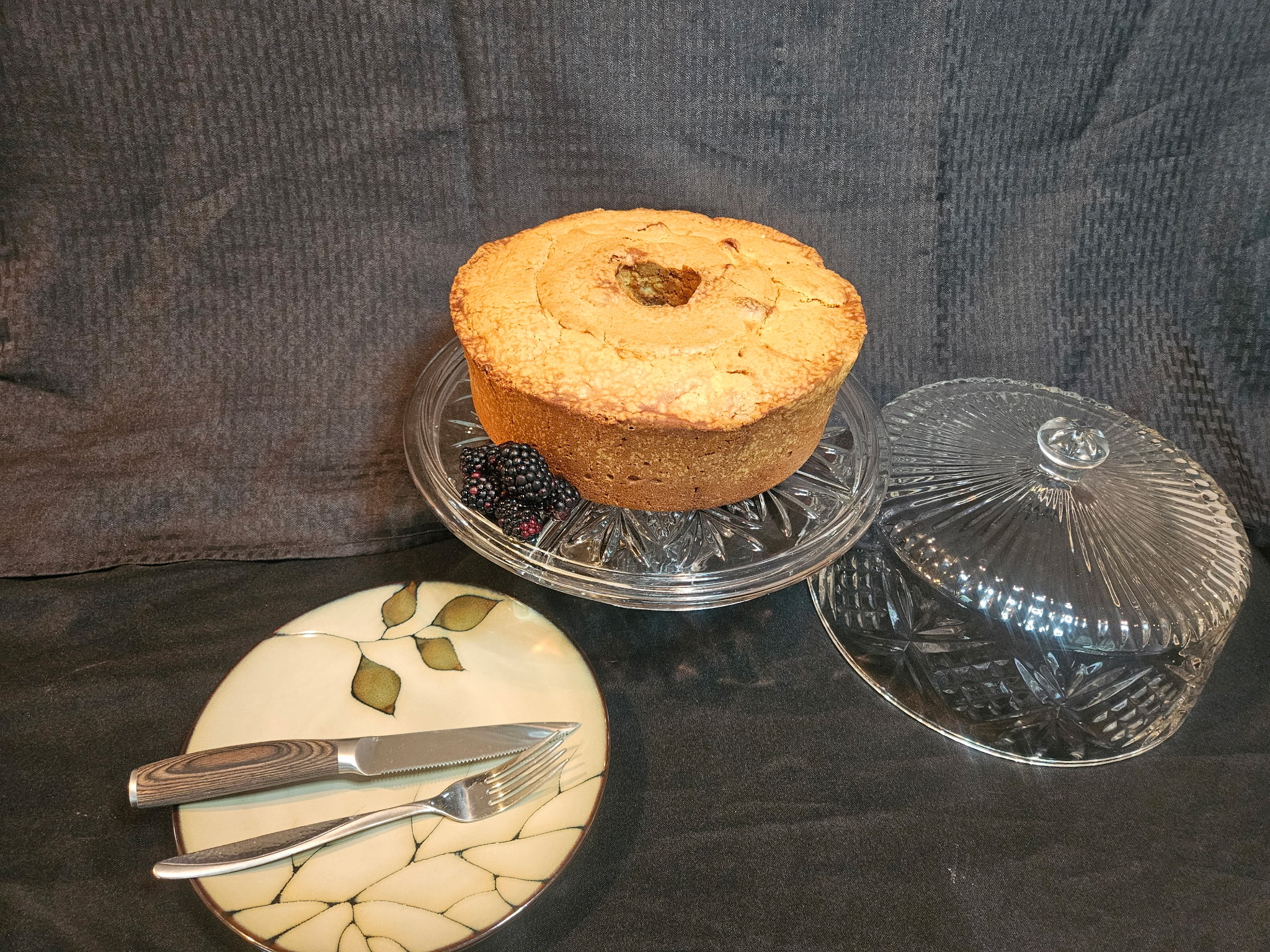 Homemade pound cake on a glass cake stand